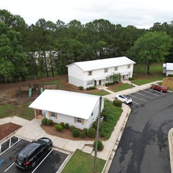 Aerial view of apartment homes, leasing office, and playground at The Savoy Apartments, located in Cartersville, GA