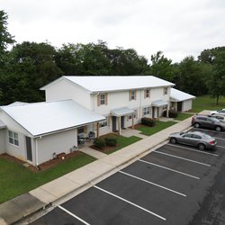 Alternative view of newly painted exteriors and the resurfaced parking lot of The Savoy Apartments, located in Cartersville, GA