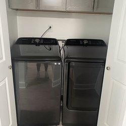 Closet-with-cabinets-and-brand-new-washer-and-dryer-at-The-Savoy-Apartments