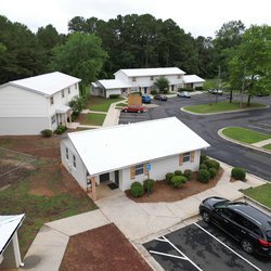 Leasing office and surrounding apartment homes at The Savoy Apartments, located in Cartersville, GA