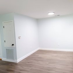Updated flooring, fresh paint, modern hardware and light fixtures in the living area of The Savoy Apartments, located in Cartersville, GA